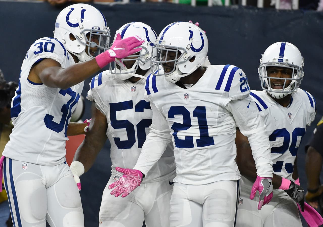 Indianapolis Colts cornerback Vontae Davis (21) celebrates with teammates after intercepting a pass by Houston Texans' Brock Osweiler during the second half of an NFL football game Sunday, October, 16, 2016, in Houston. (AP Photo/Eric Christian Smith)