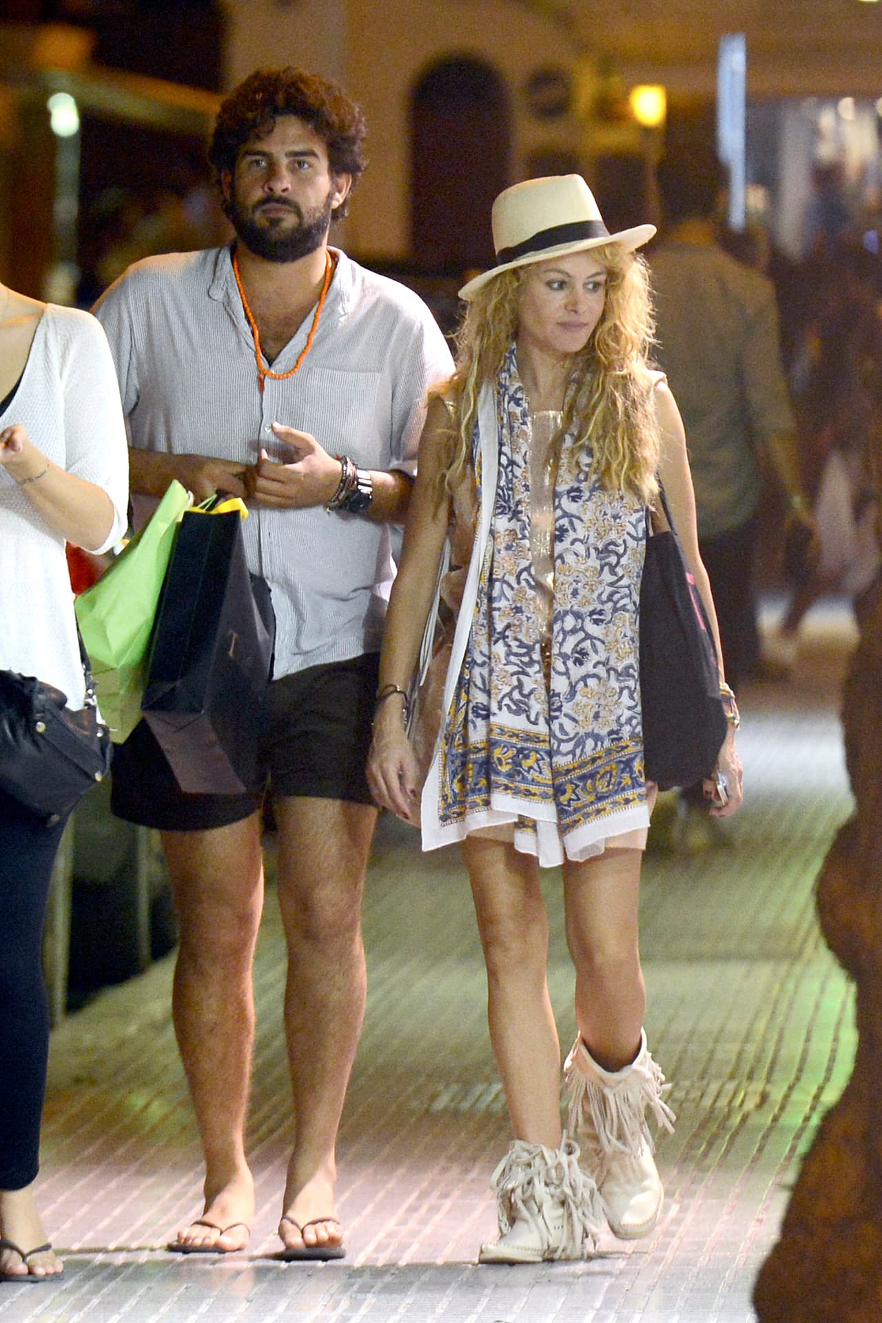 Paulina Rubio y Naomi Campell adoran las botas con flecos y las llevan esta temporada a donde sea.