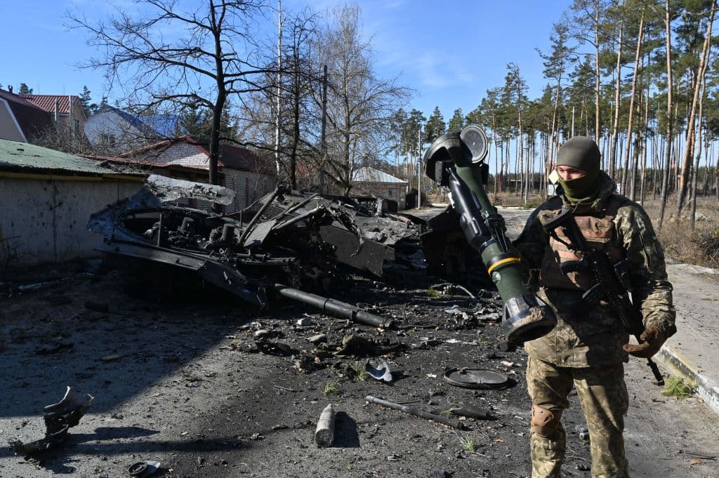 A Ukrainian soldier holds a Next Generation Light Anti-tank Weapon (NLAW) that was used to destroy a Russian armoured personal carrier (APC) in Irpin, north of Kyiv, on March 12, 2022. The NLAW is a joint Swedish-British weapon manufactured in Belfast.