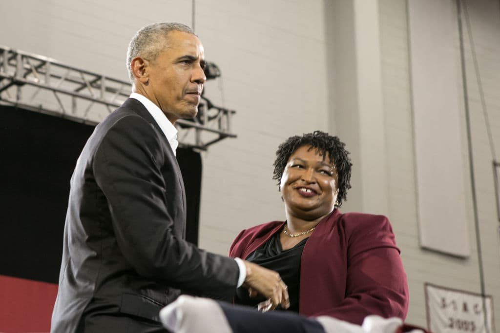 Former US President Barack Obama stands with Georgia Democratic Gubernatorial candidate Stacey Abrams during a campaign rally November 2, 2018 in Atlanta, Georgia.