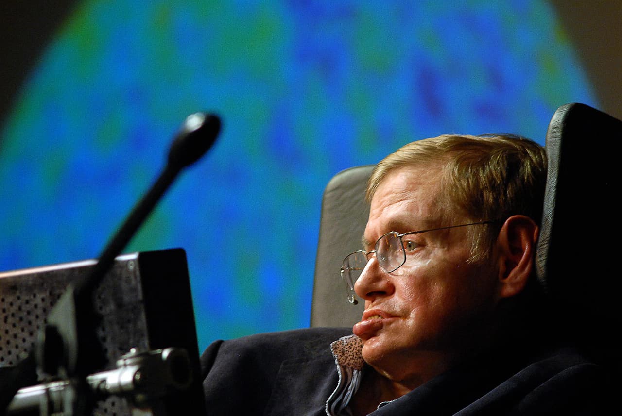 World reknown british astrophysicist Stephen Hawking delivers a lecture on the origin of the universe to coincide with the anouncement of the "Next Einstein" initiative, on May 11, 2008, on the outskirts of Cape Town. The intitiative is to drive the education of mathematics and science to being a priority in Africa and was started by The African Institute for Mathematical Sciences. AFP PHOTO/RODGER BOSCH (Photo credit should read RODGER BOSCH/AFP/Getty Images)