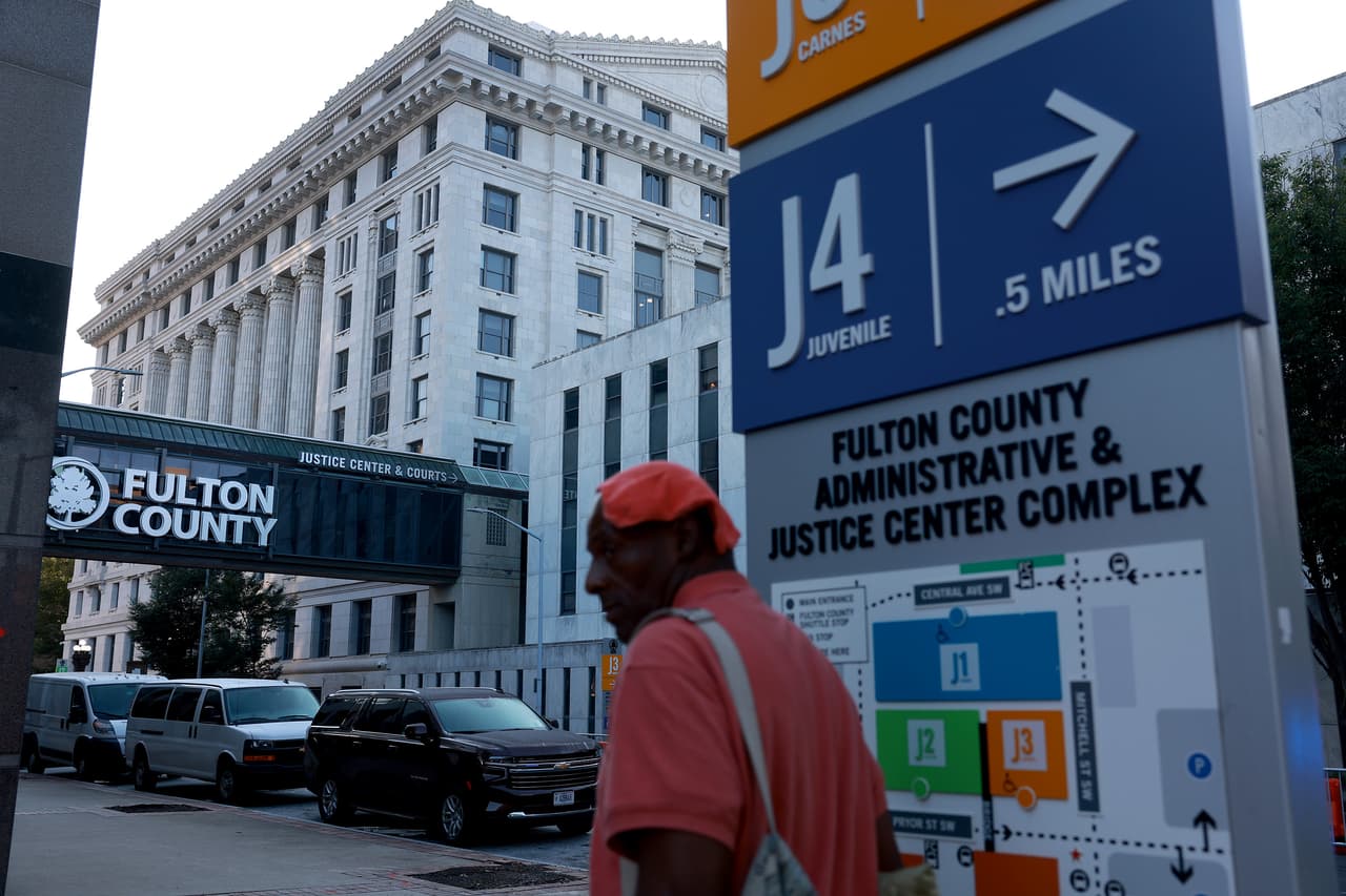 ATLANTA, GEORGIA - AUGUST 08: A person walks near the Fulton County Courthouse as more security has been put in place on August 08, 2023 in Atlanta, Georgia. The heightened security is in place as Fulton County District Attorney Fani Willis is expected to announce soon a possible grand jury indictment in her investigation into former President Donald Trump and his Republican allies' alleged attempt to overturn the 2020 election in the state. (Photo by Joe Raedle/Getty Images)