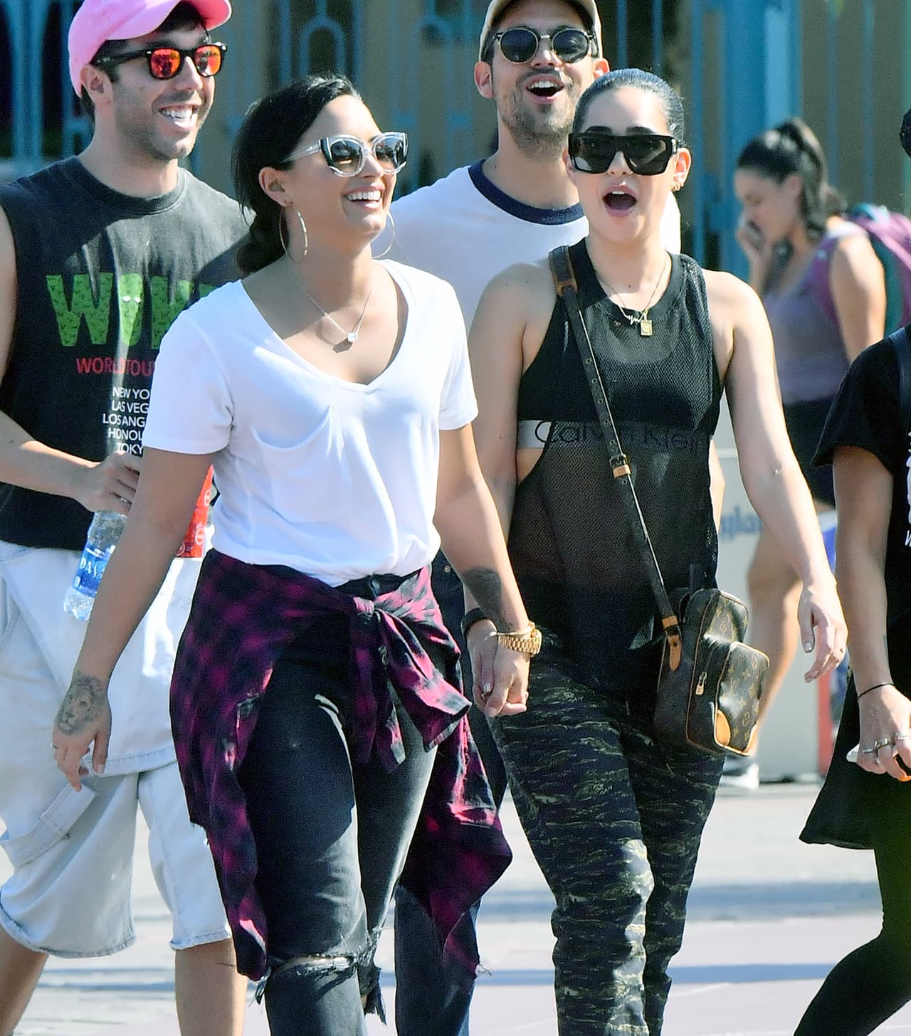 Photo © 2017 Mega/The Grosby Group EXCLUSIVE Los Angeles, CA September 11, 2017 Demi Lovato holds hands with a mystery woman while spending a happy day a Disneyland gets photobombed by Donald Duck. Demi and her new lady walked hand in hand all day Long as they enjoyed a day. they were seen riding the California screaming rollercoaster. Demi looked extremely happy.