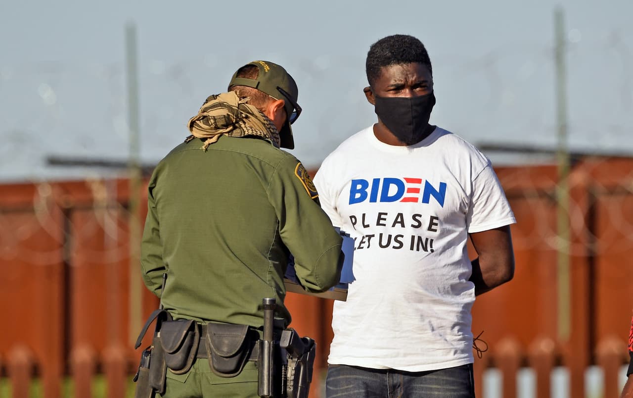 A Migrant attempting to cross in to the U.S. from Mexico are detained by U.S. Customs and Border Protection at the border April 21, 2021 in San Luis, Arizona.
