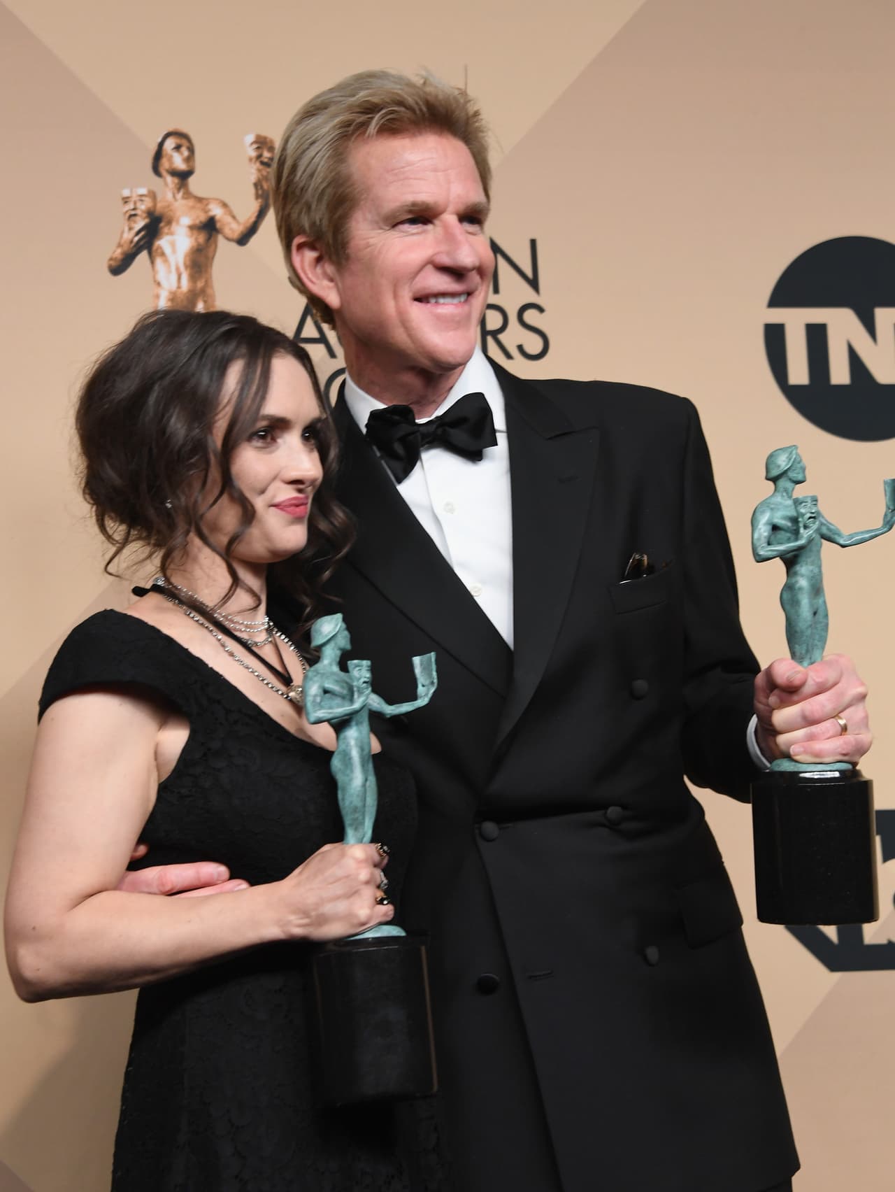LOS ANGELES, CA - JANUARY 29: Actors Winona Ryder (L) and Matthew Modine, co-recipients of the Outstanding Performance by an Ensemble in a Drama Series award for 'Stranger Things,' pose in the press room during the 23rd Annual Screen Actors Guild Awards at The Shrine Expo Hall on January 29, 2017 in Los Angeles, California. (Photo by Alberto E. Rodriguez/Getty Images)