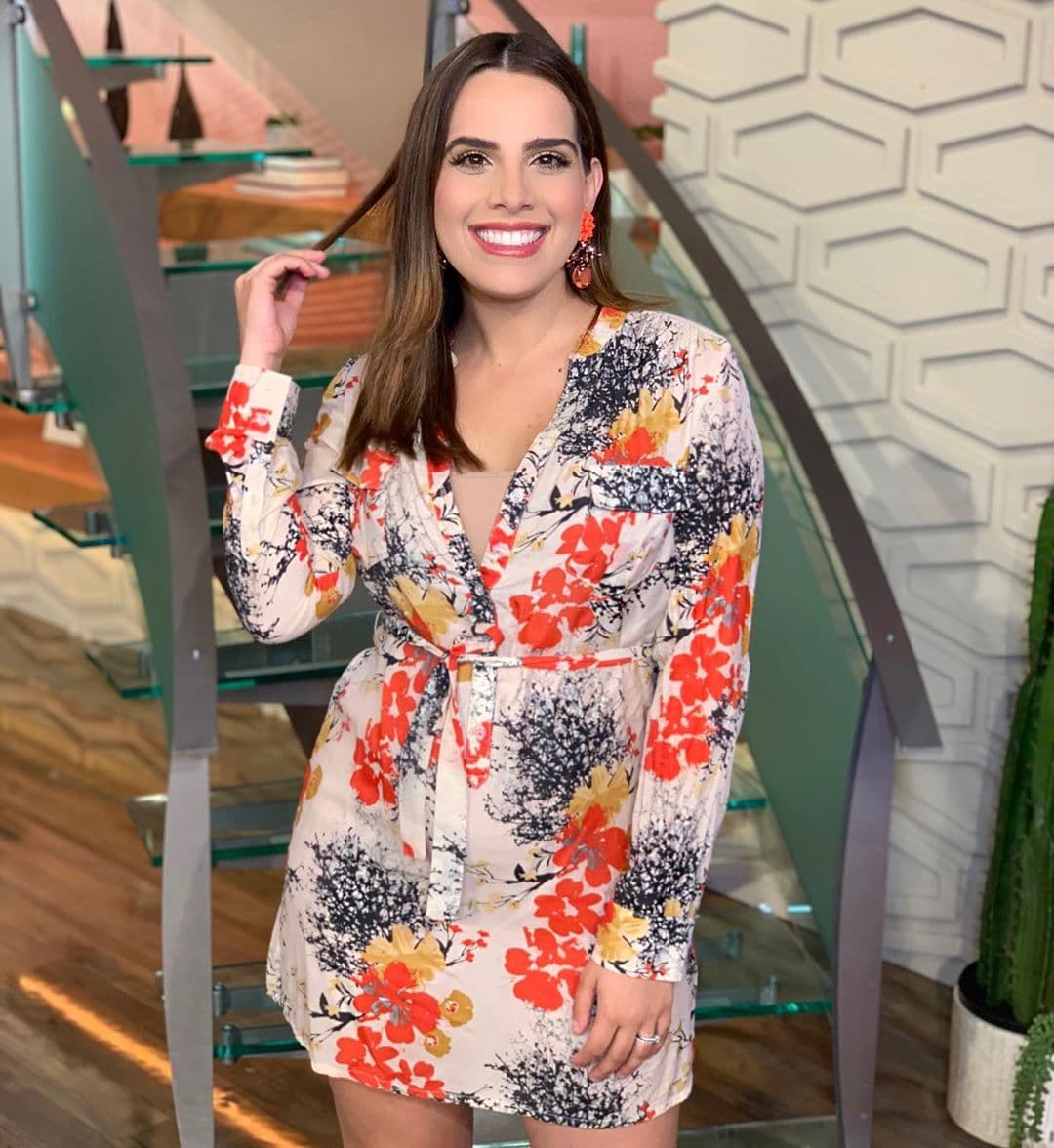 Andrea llevó otro vestido corto y ligero este verano. Enmarcó su pancita gracias al lazo bajo el pecho.