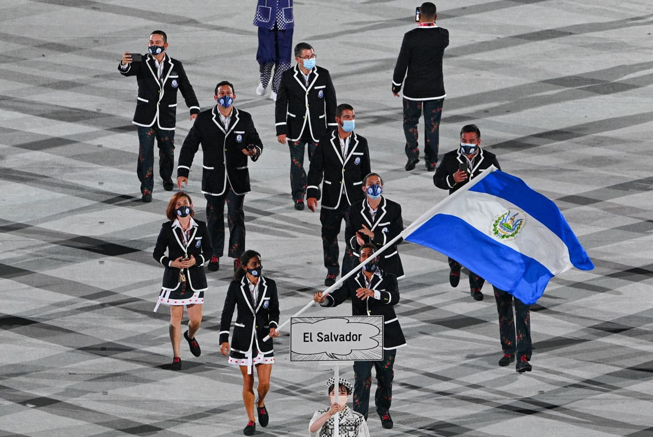 El Salvador's flag bearer Celina Marquez and Ecuador's flag bearer Julio Cesar Castillo Torres and their delegation parade during the opening ceremony of the Tokyo 2020 Olympic Games, at the Olympic Stadium, in Tokyo, on July 23, 2021. (Photo by Martin BUREAU / AFP) (Photo by MARTIN BUREAU/AFP via Getty Images)