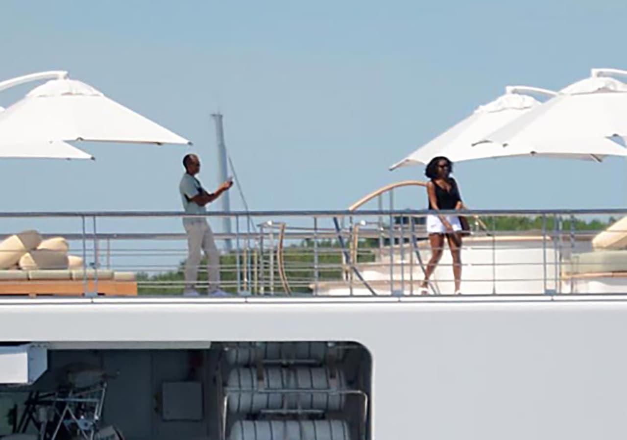 Photo © 2017 Zuma Press/The Grosby Group EXCLUSIVE Moorea, April 14, 2017. Former U.S. President Barack Obama takes a holiday photo of his wife, Michelle, as she poses on the top deck of the 138 meter Rising Sun yacht where the couple and celebrity friends spent the morning off the Island of Moorea, in the South Pacific, part of French Polynesia on April 14, 2017. The Obamas were vacationing with Bruce Springsteen, Tom Hanks and Oprah Winfrey and spent two hours aboard music mogul David Geffen's luxury yacht before leaving Tahiti.