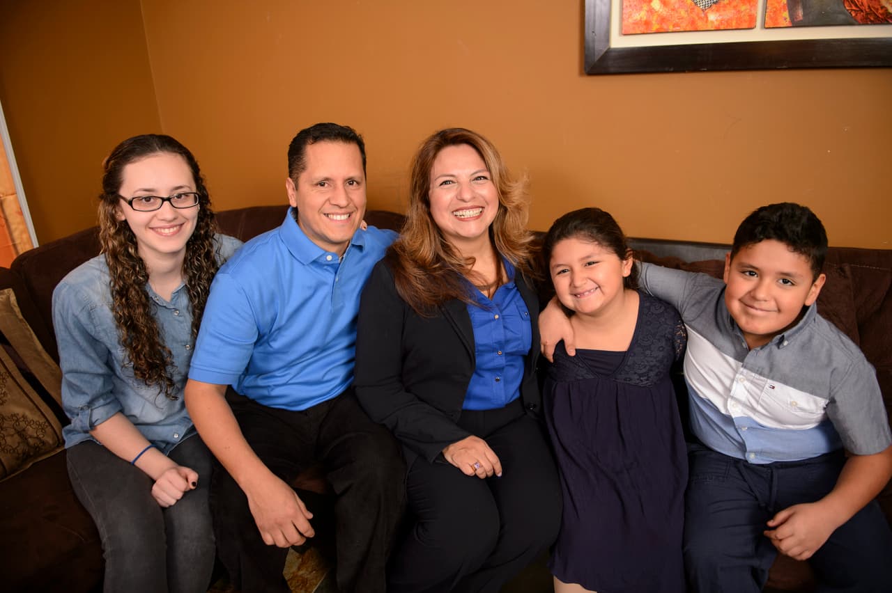Guzman with her husband, Carlos, and three of their four children.