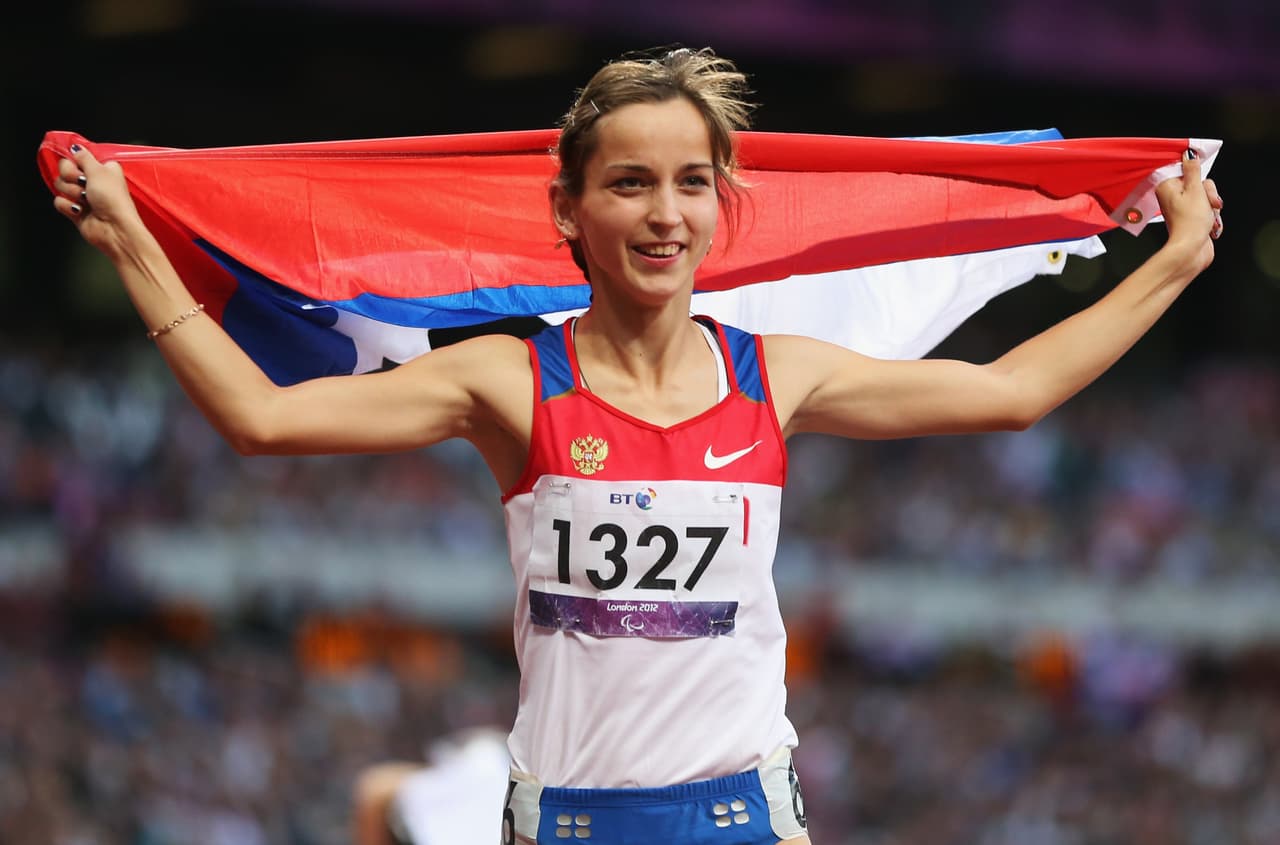 LONDON, ENGLAND - SEPTEMBER 08: Elena Ivanova of Russia celebrates as she wins gold in the Women's 100m T36 Final on day 10 of the London 2012 Paralympic Games at Olympic Stadium on September 8, 2012 in London, England. (Photo by Bryn Lennon/Getty Images)