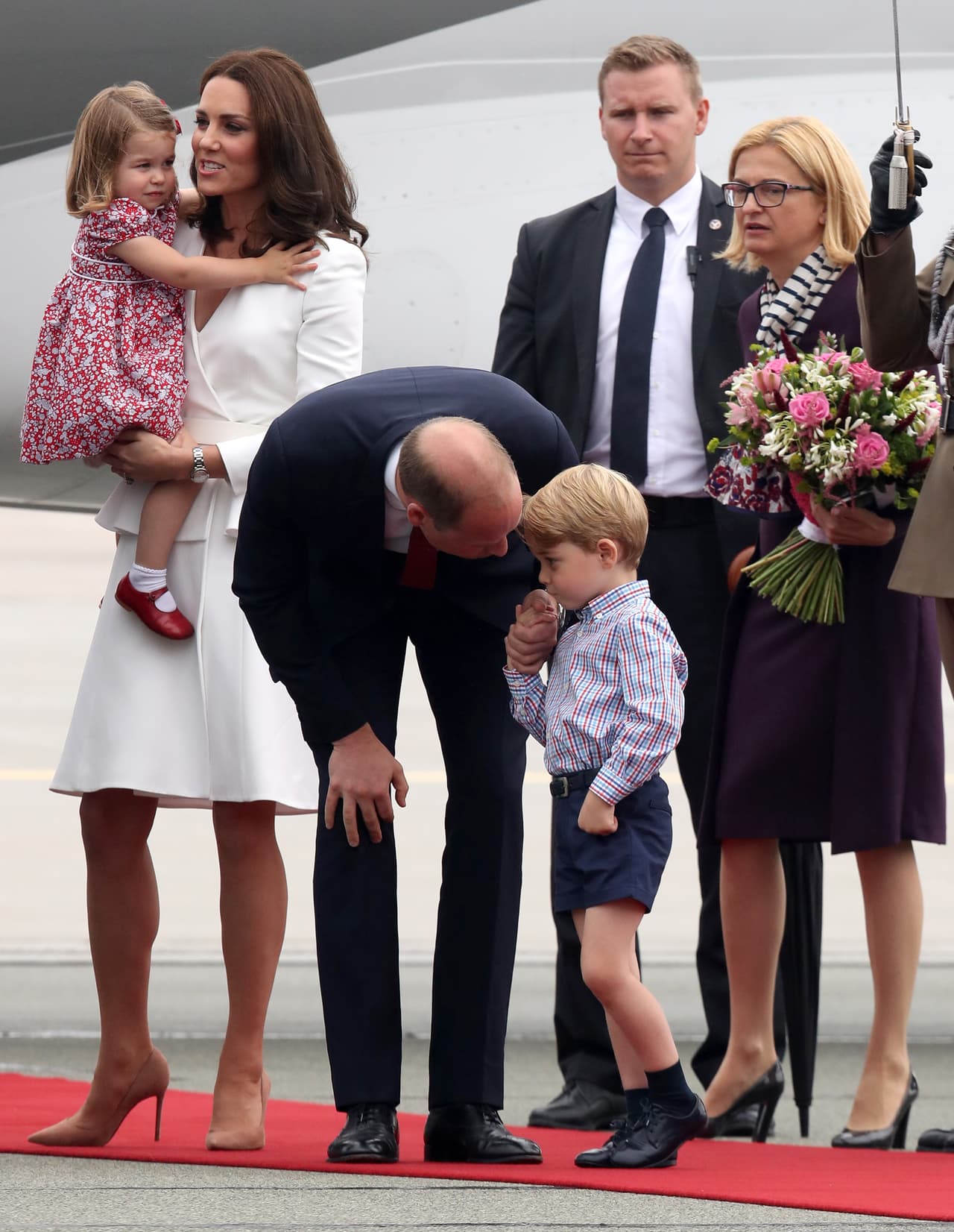 WARSAW, POLAND - JULY 17: Prince William, Duke of Cambridge speaks with Prince George of Cambridge as they arrive with Catherine, Duchess of Cambridge and Princess Charlotte of Cambridge on day 1 of their offical visit to Poland on July 17, 2017 in Warsaw, Poland. (Photo by Chris Jackson/Getty Images)