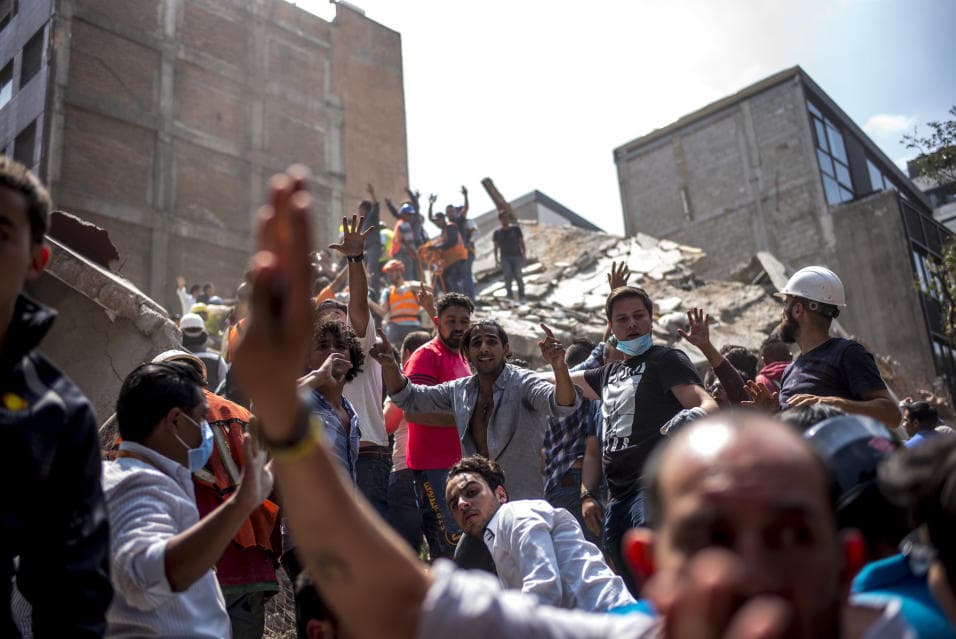 Rescuers called for silence as they looks for trapped survivors in a Mexico City building that collapsed during the Sept 19 earthquake.