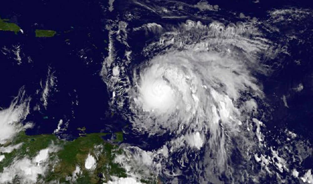 This Sunday, Sept. 17, 2017, GOES East satellite image provided by NASA taken at 7:45 p.m EDT, shows Hurricane Maria as it approaches the Lesser Antilles. Maria swiftly grew into a hurricane Sunday, and forecasters said it was expected to become much stronger over the coming hours following a path that would take it near many of the islands wrecked by Hurricane Irma and then on toward Puerto Rico, the Dominican Republic and Haiti. (NASA via AP)