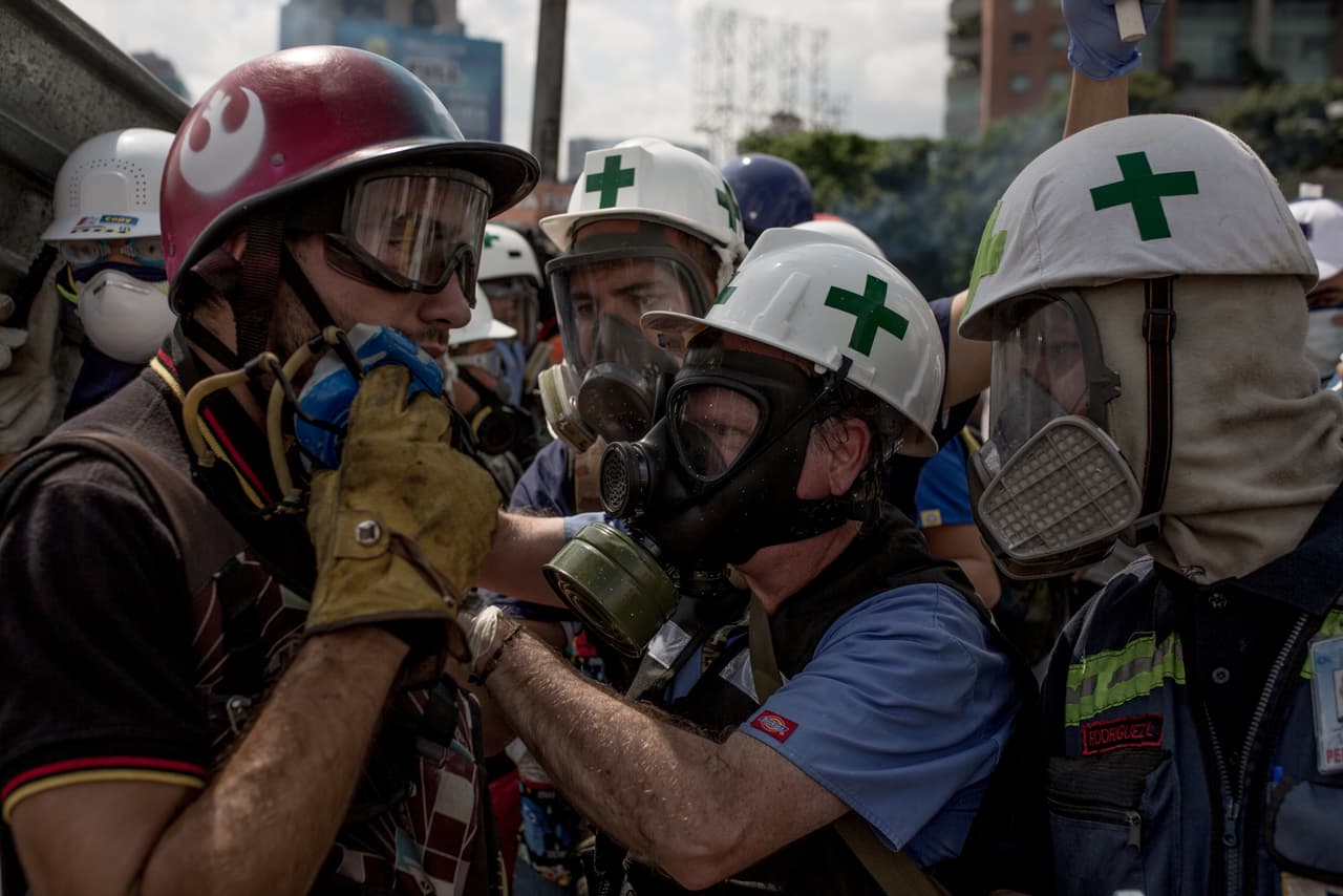 Dozens of doctors, medical students and volunteers of the First Aid team at the Central University of Venezuela spread out at the protests ready to attend victims where they fall.