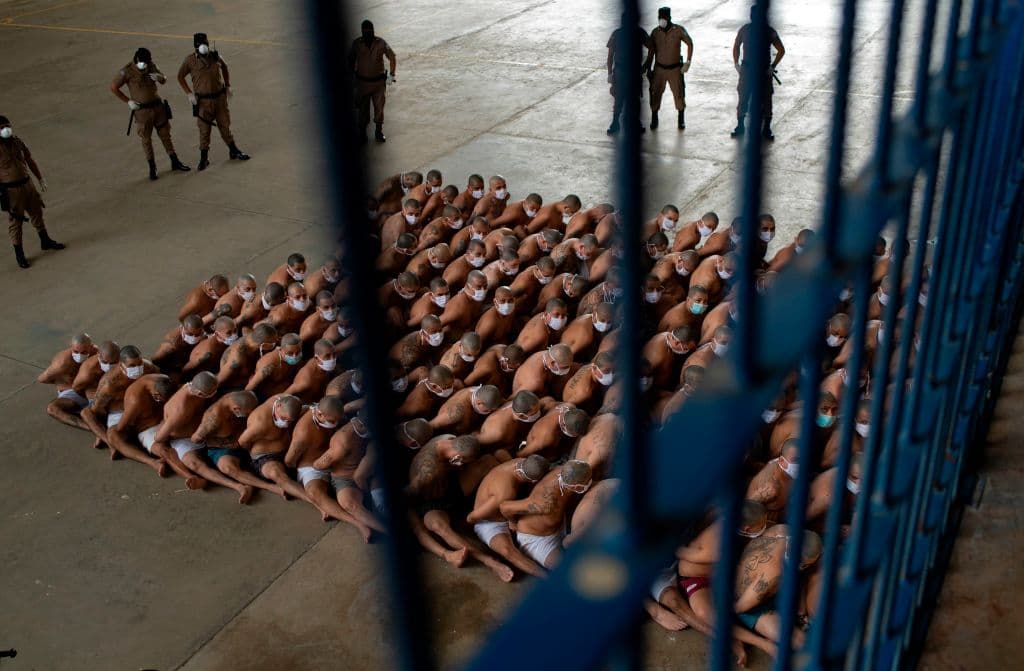 Members of the "Mara 18" and "MS-13" gangs are seen in custody of guards at a maximum security prison in Izalco, Sonsonate, El Salvador on September 4, 2020, amid the new coronavirus pandemic.