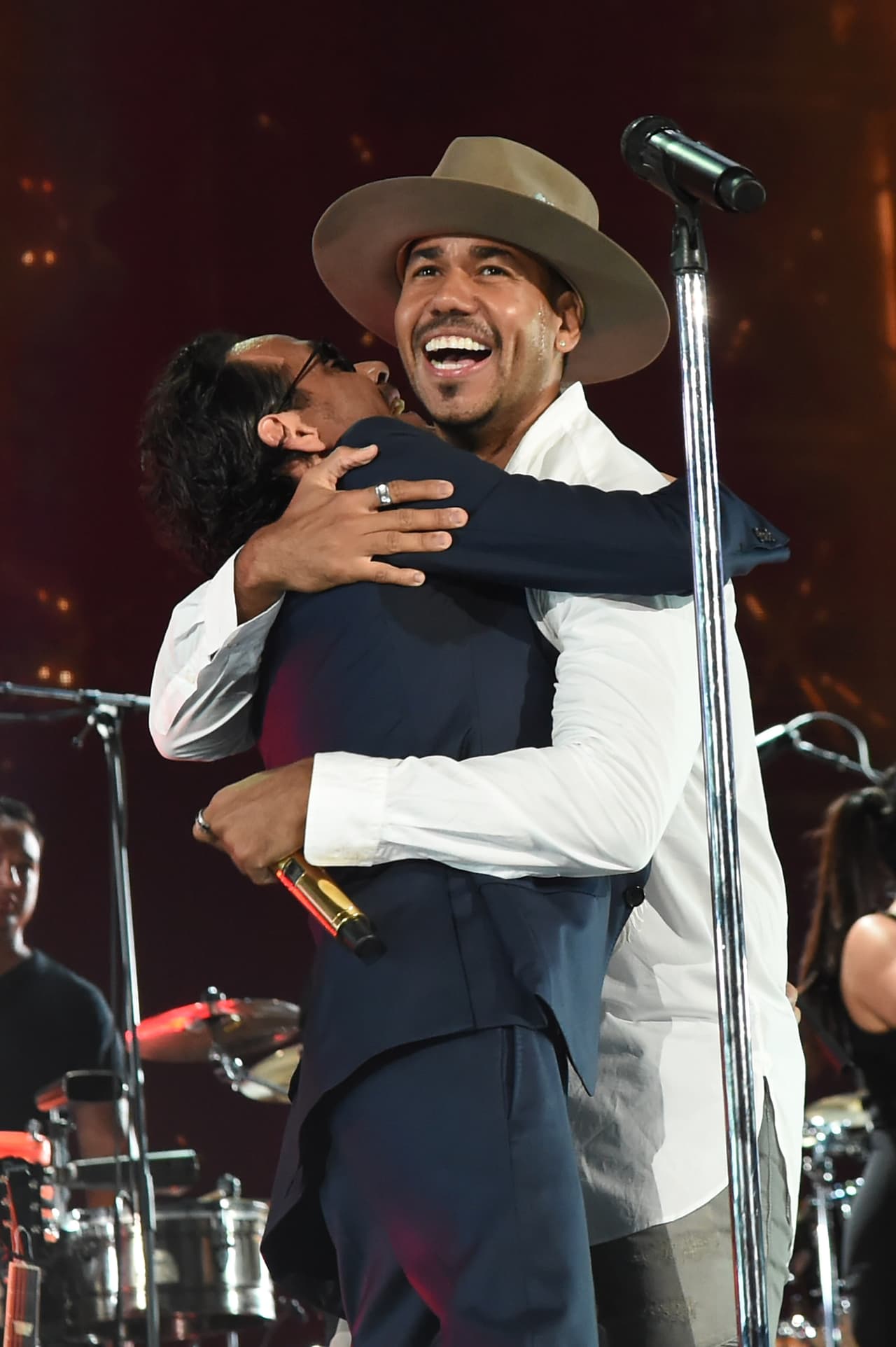 MIAMI, FL - OCTOBER 14: In this handout photo provided by One Voice: Somos Live!, Marc Anthony and Romeo Santos perform onstage at One Voice: Somos Live! A Concert For Disaster Relief at Marlins Park on October 14, 2017 in Miami, Florida. (Photo by Rick Diamond/One Voice: Somos Live!/Getty Images)