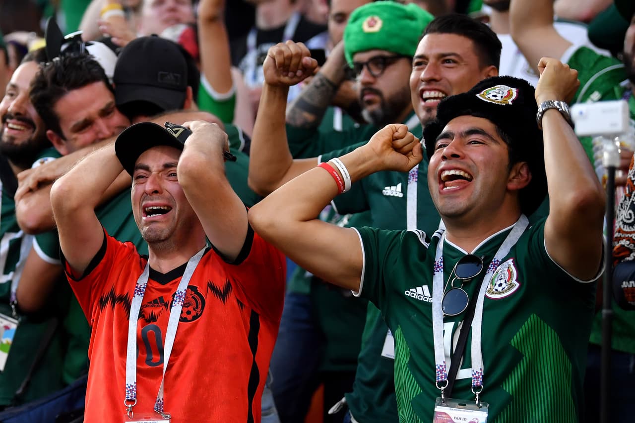 YEKATERINBURG, RUSSIA - JUNE 27: Mexico fans celebrate after hearing the news of a Korea Republic goal that will send Mexico in Round of 16 during the 2018 FIFA World Cup Russia group F match between Mexico and Sweden at Ekaterinburg Arena on June 27, 2018 in Yekaterinburg, Russia. (Photo by Hector Vivas/Getty Images)