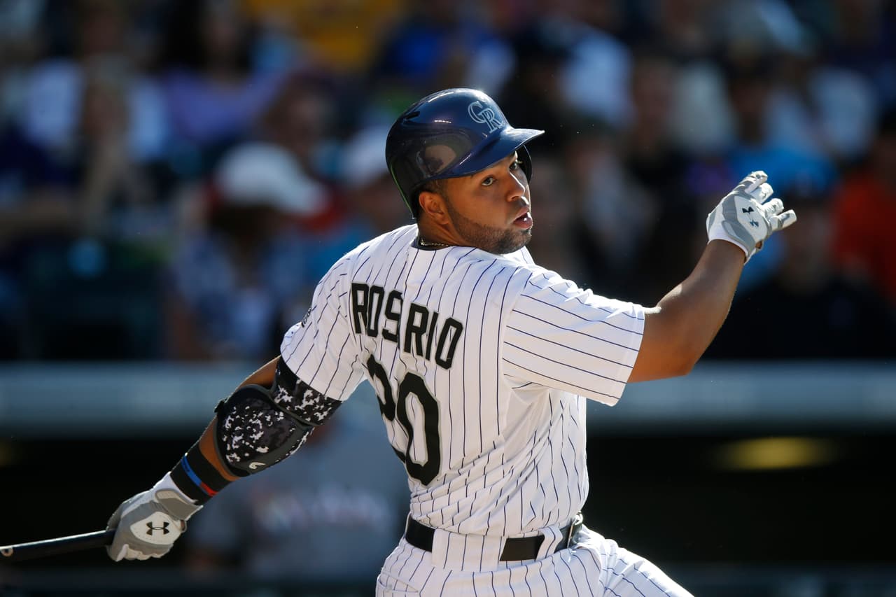 Rosario pega dos jonrones y da triunfo a Rockies contra Marlins