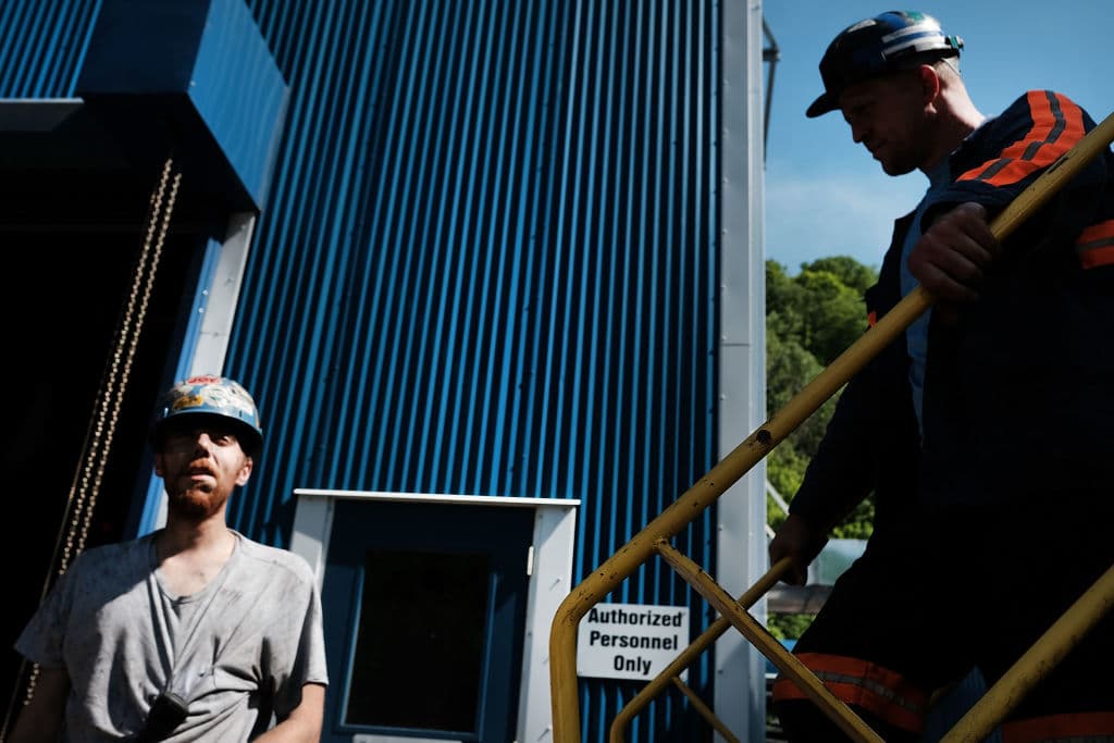WELCH, WV - MAY 19: Men pause while working at a coal prep plant on May 19, 2017 outside the city of Welch, West Virginia. West Virginia, a state where President Donald Trump won in a landslide by defeating Hillary Clinton 67.9 percent to 26.2 percent, is also one of the nations poorest states where nearly one in five West Virginians struggled to afford basic necessities in 2015. The state was historically dependent on coal mining and manufacturing. While mine employment is up slightly since the election, the state has continued to see a surge in male unemployment and an epidemic of opioid use among its population. (Photo by Spencer Platt/Getty Images)
