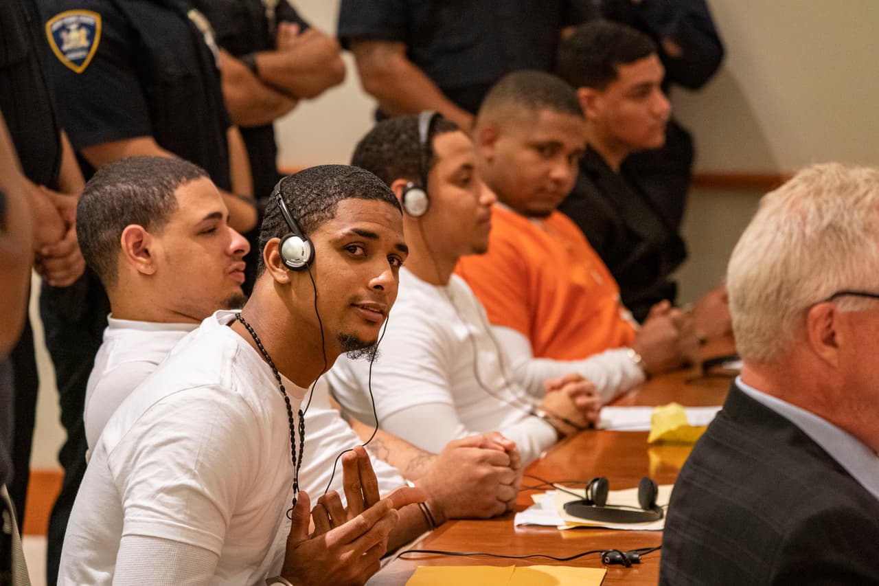 <b>Antonio Rodríguez Hernández Santiago</b> y 
<b>Elvin García</b> (cuarto y quinto de izquierda a derecha) fueron sentenciados a cadena perpetua con 25 años en prisión antes de poder recibir algún beneficio que les permita salir de la cárcel.