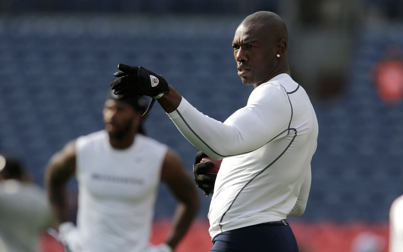 Seattle Seahawks' Terrell Owens gestures during warm-ups before an NFL football preseason game against the Denver Broncos, Saturday, Aug. 18, 2012, in Denver. (AP Photo/Joe Mahoney)