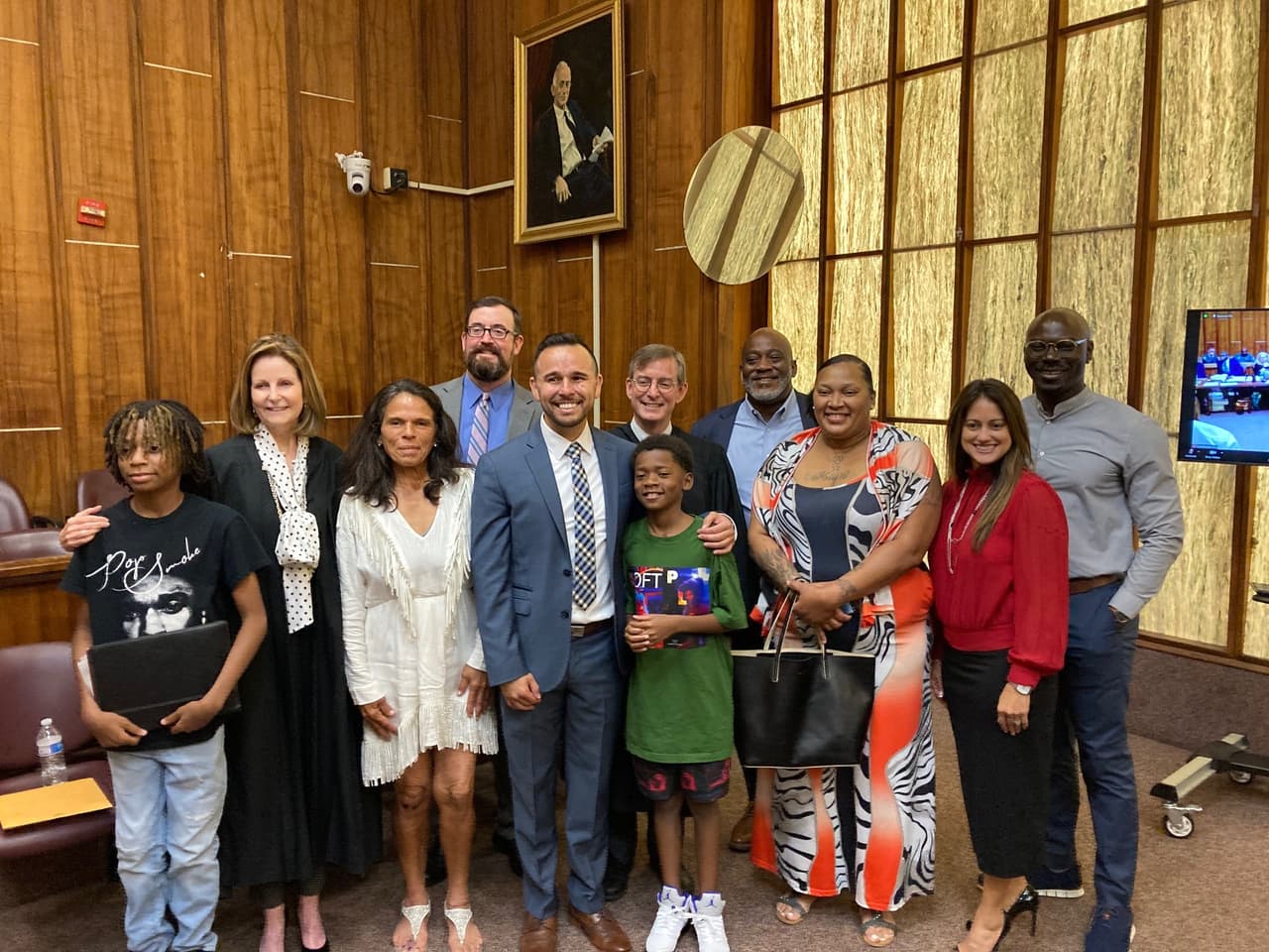 Former felon, Angel Sanchez, with his family and friends after being sworn in to the Washington DC bar in the Miami courthouse where he was sentenced to 30 years in prison in in 1999. Sept 16, 2022.