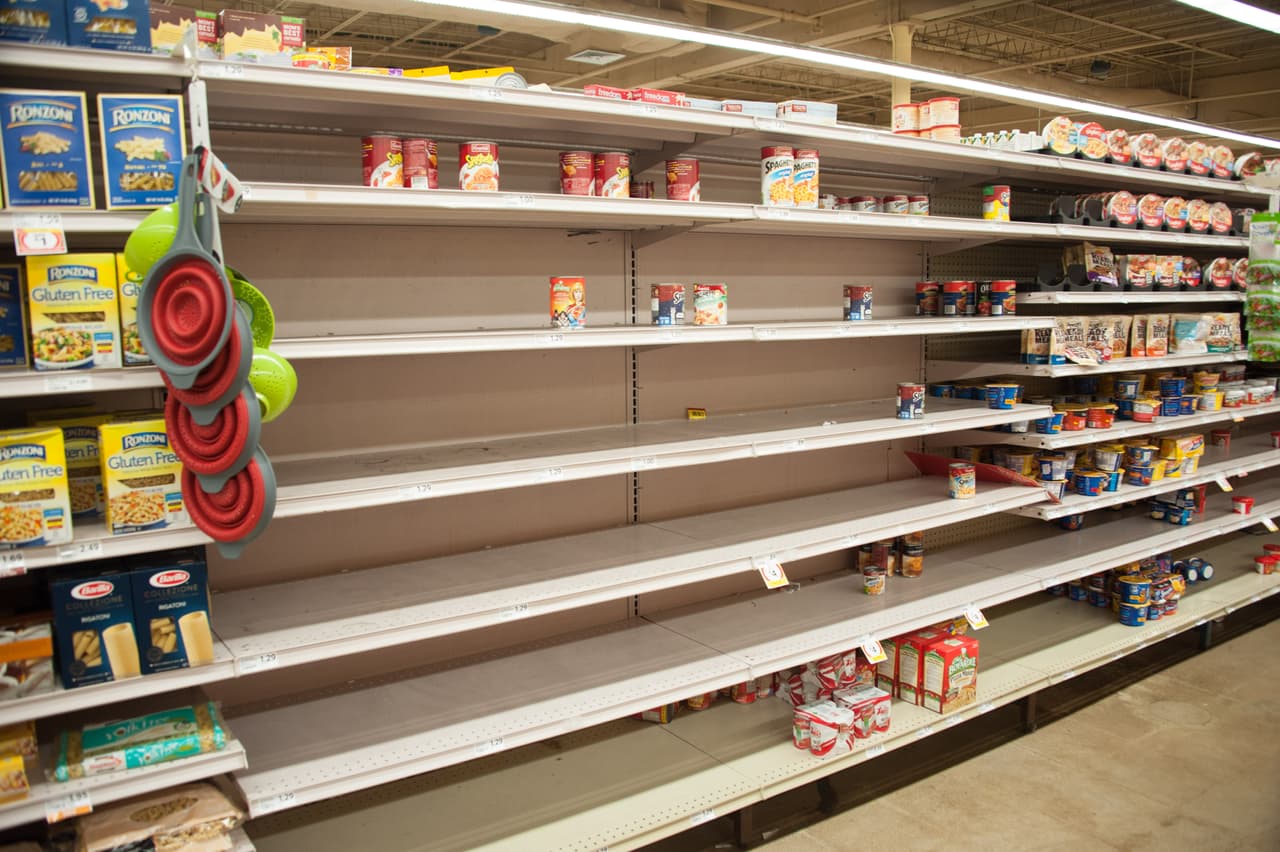 Empty shelves are seen as people make Hurricane Irma preparations at a Winn Dixie store in South Florida on September 6, 2017 in Hallandale, Florida. Hurricane Irma, one of the most powerful Atlantic storms on record, cut a deadly swath through a string of small Caribbean islands on Wednesday and was on a collision course with Puerto Rico and potentially south Florida. / AFP PHOTO / Michele Eve Sandberg (Photo credit should read MICHELE EVE SANDBERG/AFP/Getty Images)
