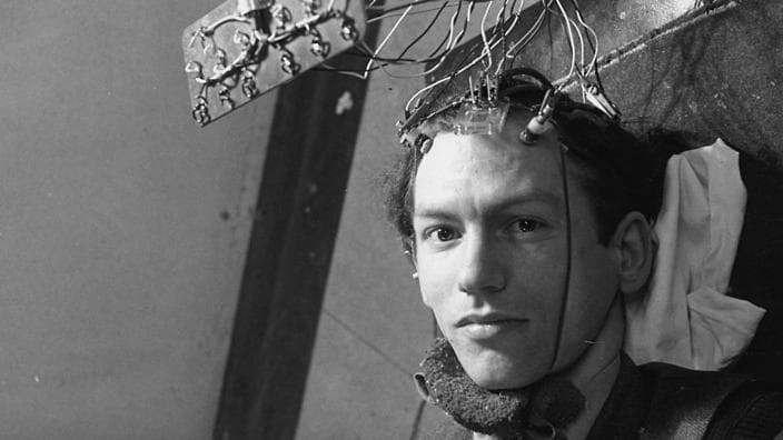 A patient is connected to an encephalogram machine, which will record his brain's activity by reading the rhythmic electric pulses it emits. This takes place in the laboratory of Dr Grey Walter at the Burden Neurological Institute at Bristol University. Original Publication: Picture Post - 4998 - New Light On The Brain - pub. 1950 (Photo by Charles Hewitt/Getty Images)