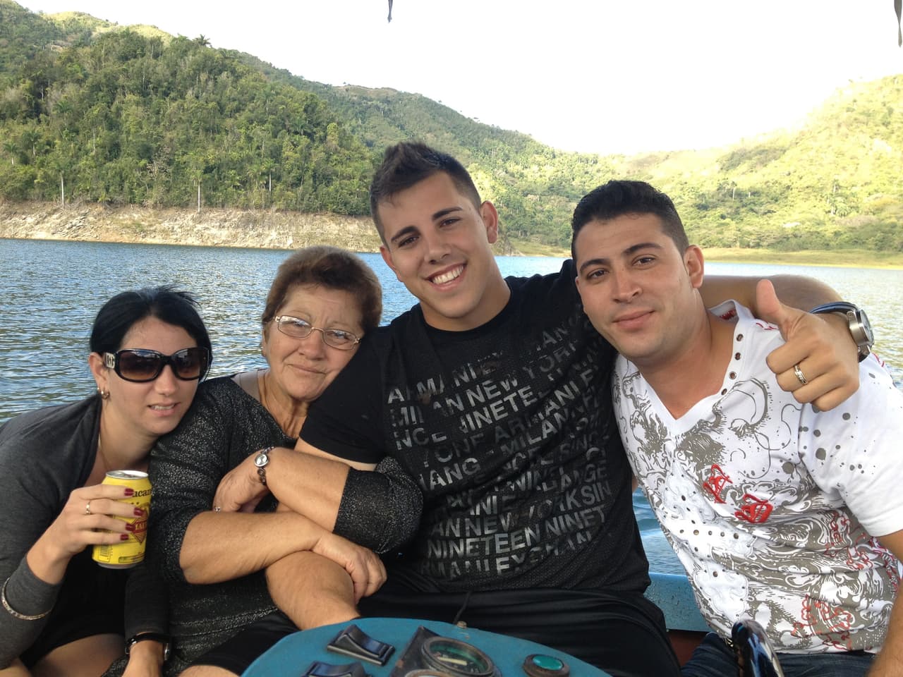 José Delfin with his cousin Yordy (right) and grandmother Olga (seconf left) at Hananabilla Lake, one of his favorites spots in Cuba. Courtesy of the Fernández family/Univision.