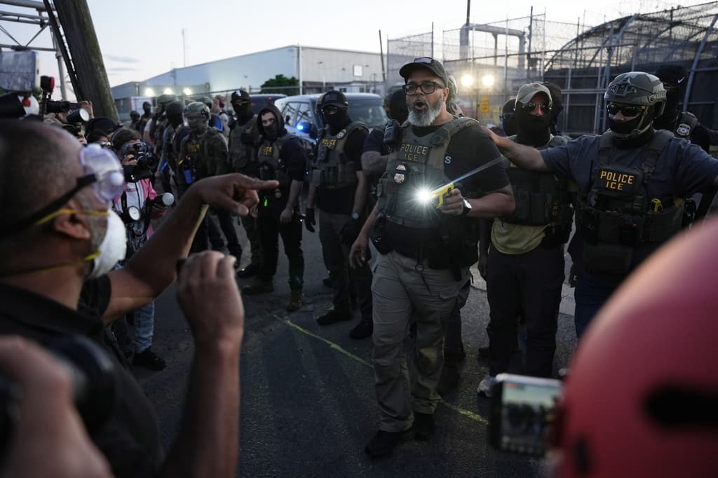 Federal immigration officers confront protesters outside Delaney Hall detention center Thursday, May 28, 2026, in Newark, N.J. (AP Photo/Angelina Katsanis)