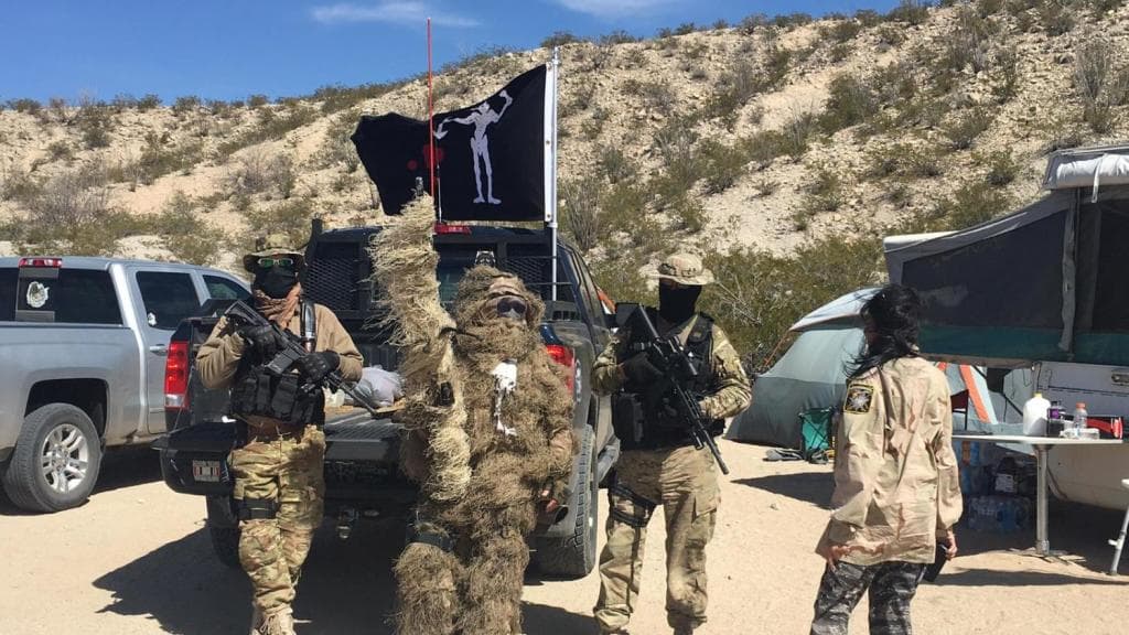 Militiamen 'Viper' and 'Stringer' patrolling in March, looking for undocumented immigrants who cross into the US. In the center of the image, Stringer in a Chewbacca-like camouflage uniform with a sniper rifle.