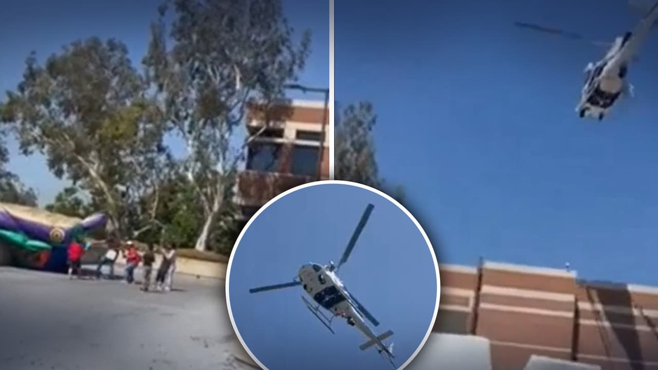 Inflable con niños adentro es levantado a los aires por un helicóptero