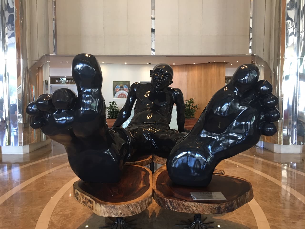 The lobby of Trump's Panama hotel is dominated by a large wood sculpture titled 'Big Foot,' by French-Israeli artist Idan Zareski. "It carries the odors of mass deportation, forced labor, slavery and abuse that countless cultures have suffered through history," according to the online art gallery Saatchi Art. 
<br>