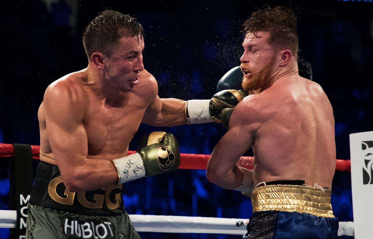 LAS VEGAS, NV - SEPTEMBER 16: Gennady Golovkin punches Canelo Alvarez during their WBC, WBA and IBF middleweight championship bout at T-Mobile Arena on September 16, 2017 in Las Vegas, Nevada. (Photo by Al Bello/Getty Images)