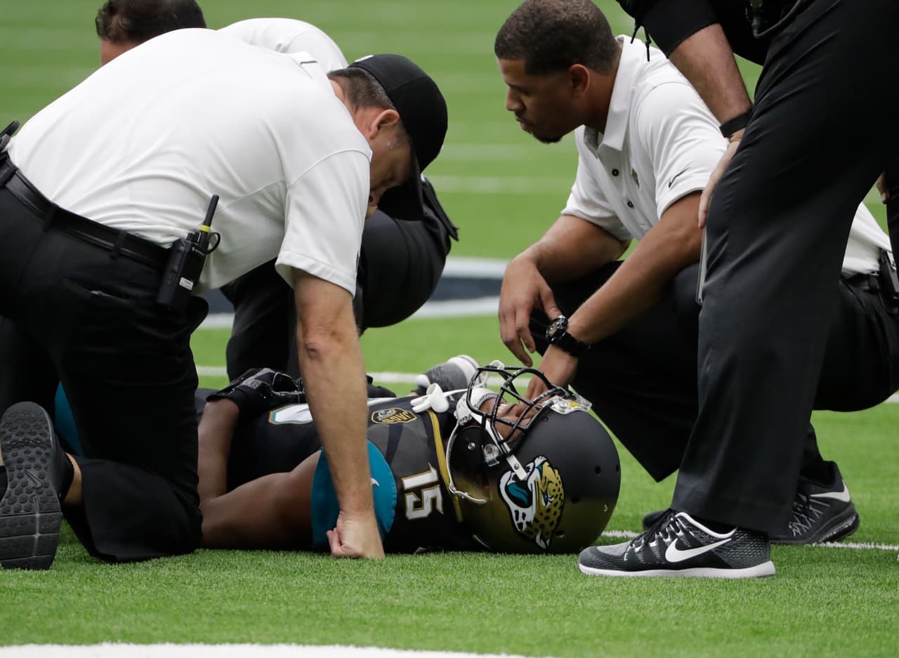 Jacksonville Jaguars wide receiver Allen Robinson (15) is tended to by medical staff after an injury while facing the Houston Texans in the first half of an NFL football game Sunday, Sept. 10, 2017, in Houston. (AP Photo/David J. Phillip)