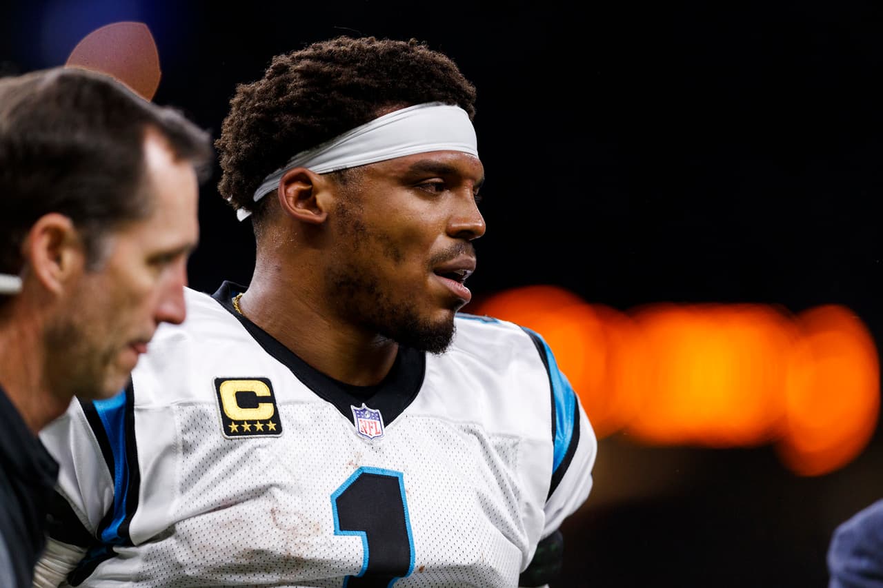 Carolina Panthers quarterback Cam Newton (1) gets walked off the field after a hit during an NFL football NFC wild card playoff game against the New Orleans Saints, Sunday, Jan. 7, 2018, in New Orleans. The Saints defeated the Panthers, 31-26. (Ryan Kang via AP)