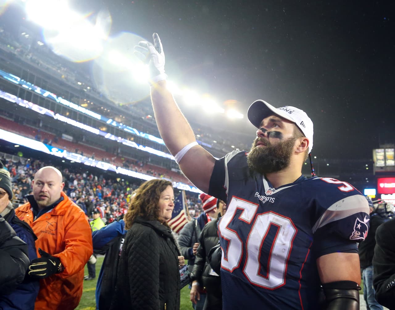New England Patriots Rob Ninkovich (50) salutes the Patriots fans after the AFC championship NFL football game, Sunday, Jan. 22, 2017, in Foxborough, Mass. (Tom DiPace via AP)