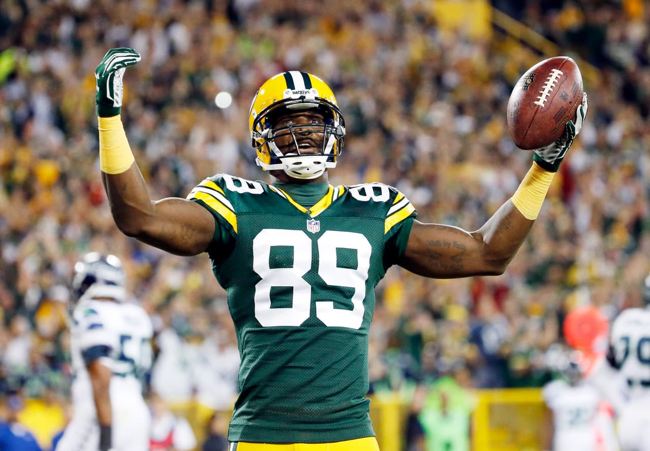Green Bay Packers' James Jones celebrates a touchdown catch during the first half of an NFL football game against the Seattle Seahawks Sunday, Sept. 20, 2015, in Green Bay, Wis. (AP Photo/Mike Roemer)
