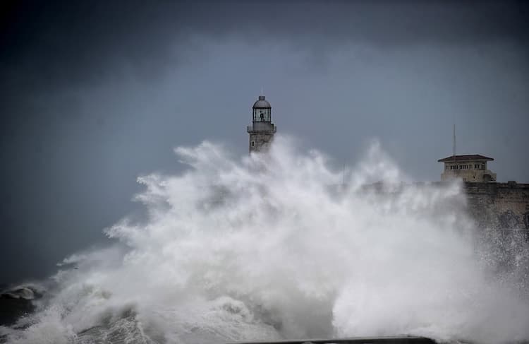 A huge wave breaks near the Morro Castle in Havana, Cuba, on Sunday, September 10, 2017. More than a million people were evacuated in Cuba from the path of Irma, the first Category 5 storm to hit the nation in almost a century.