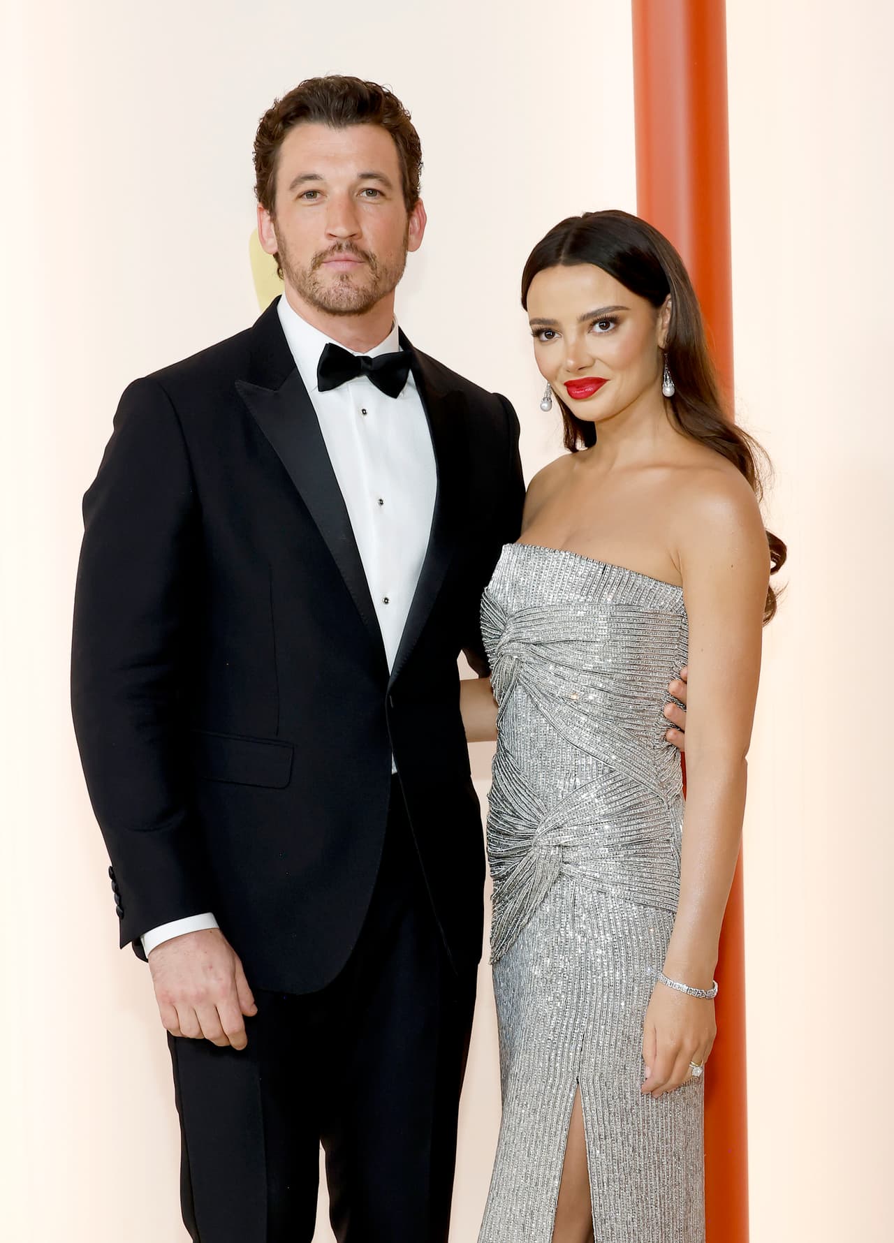 HOLLYWOOD, CALIFORNIA - MARCH 12: (L-R) Miles Teller and Keleigh Sperry Teller attend the 95th Annual Academy Awards on March 12, 2023 in Hollywood, California. (Photo by Mike Coppola/Getty Images)
