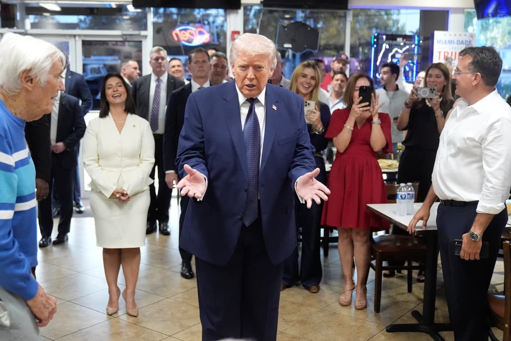 President Donald Trump speaks as he visits Venezuelan restaurant El Arepazo, Monday, March 9, 2026, in Doral, Fla. (AP Photo/Mark Schiefelbein)