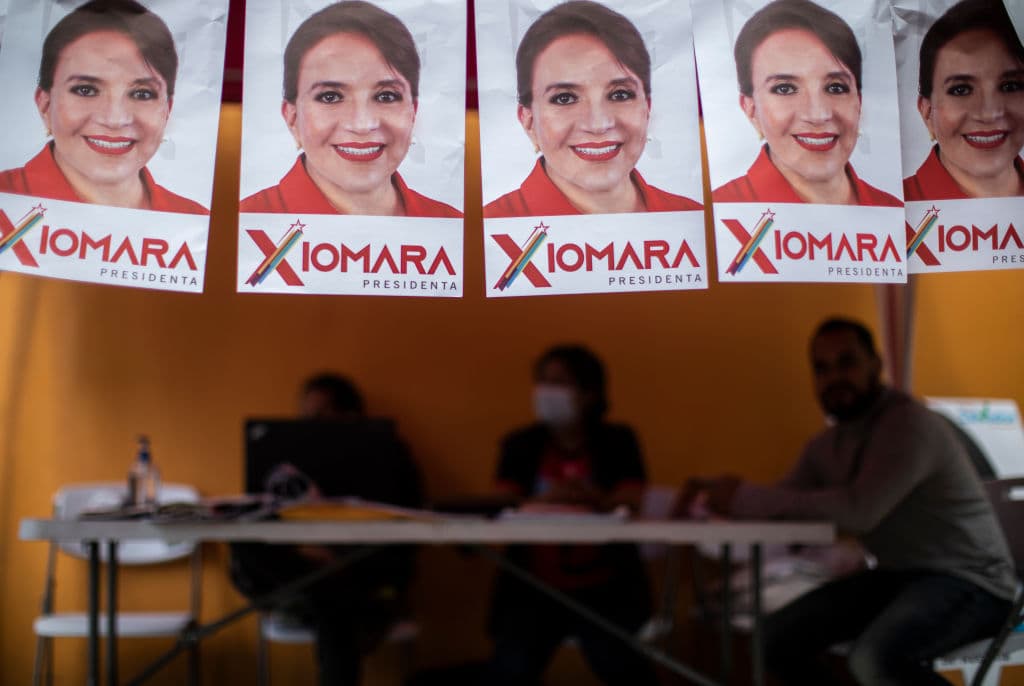 Supporters prepare ahead of the elections with posters of Presidential Candidate Xiomara Castro for Freedom and Refoundation Party (Libre) on November 27, 2021 in Tegucigalpa, Honduras.