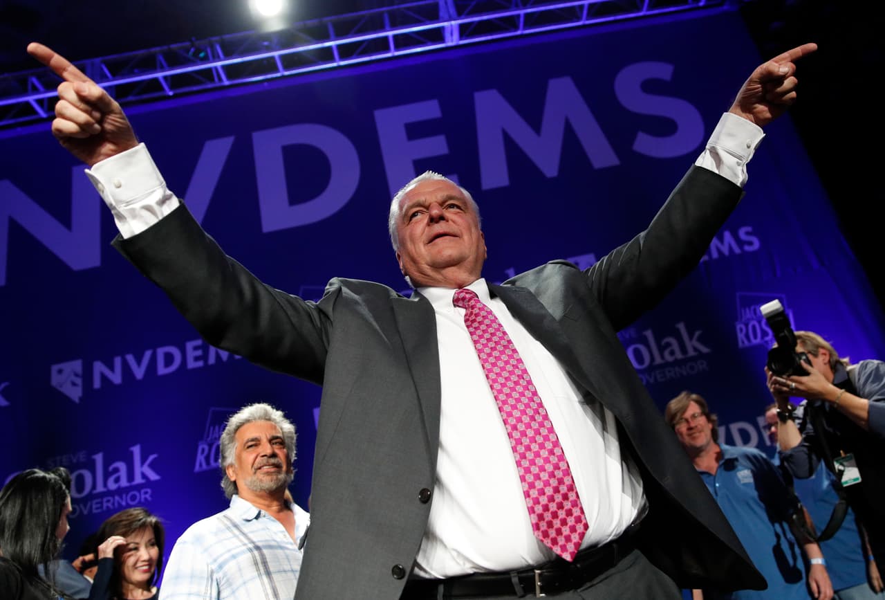 Clark County Commission Chair and Democratic gubernatorial candidate Steve Sisolak celebrates with supporters Wednesday, Nov. 7, 2018, in Las Vegas. (AP Photo/John Locher)
