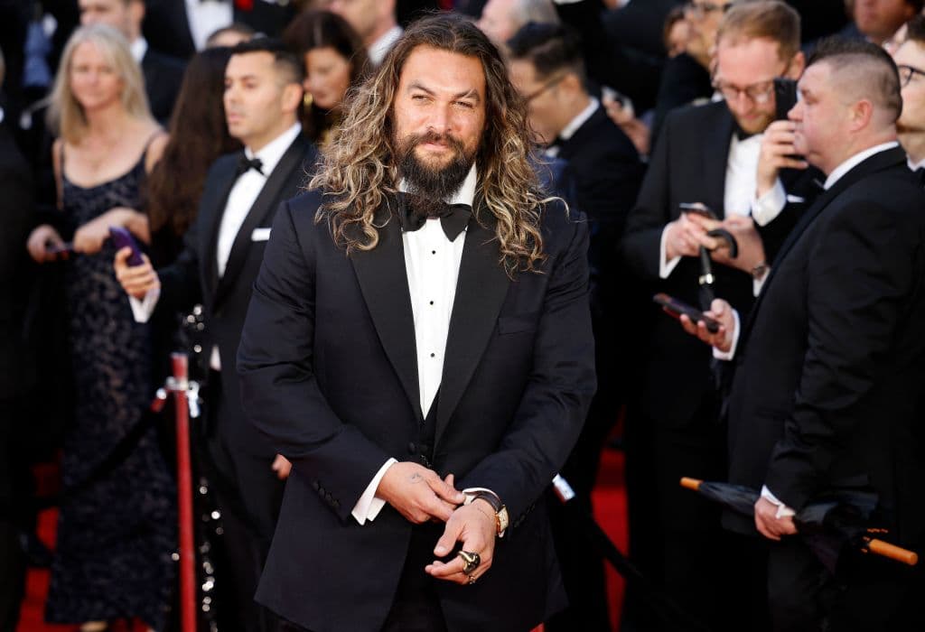 US actor Jason Momoa poses on the red carpet after arriving to attend the World Premiere of the James Bond 007 film "No Time to Die" at the Royal Albert Hall in west London on September 28, 2021. - Celebrities and royals walk the red carpet in central London on Tuesday for the star-studded but much-delayed world premiere of the latest James Bond film, "No Time To Die". (Photo by Tolga Akmen / AFP) (Photo by TOLGA AKMEN/AFP via Getty Images)