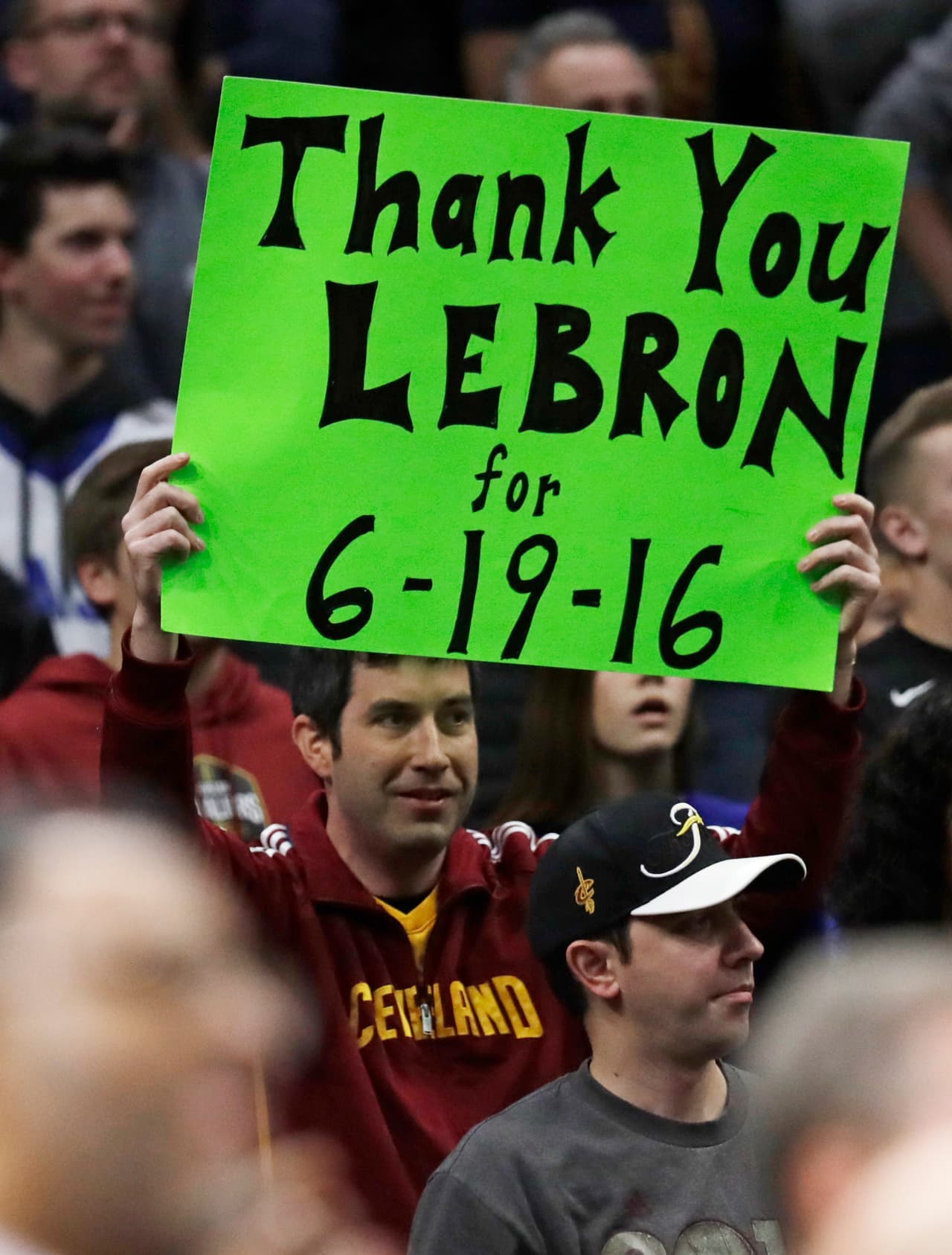 A Cleveland Cavaliers fan holds up thanking Los Angeles Lakers' LeBron James before an NBA basketball game between the Lakers and the Cleveland Cavaliers, Wednesday, Nov. 21, 2018, in Cleveland. (AP Photo/Tony Dejak)