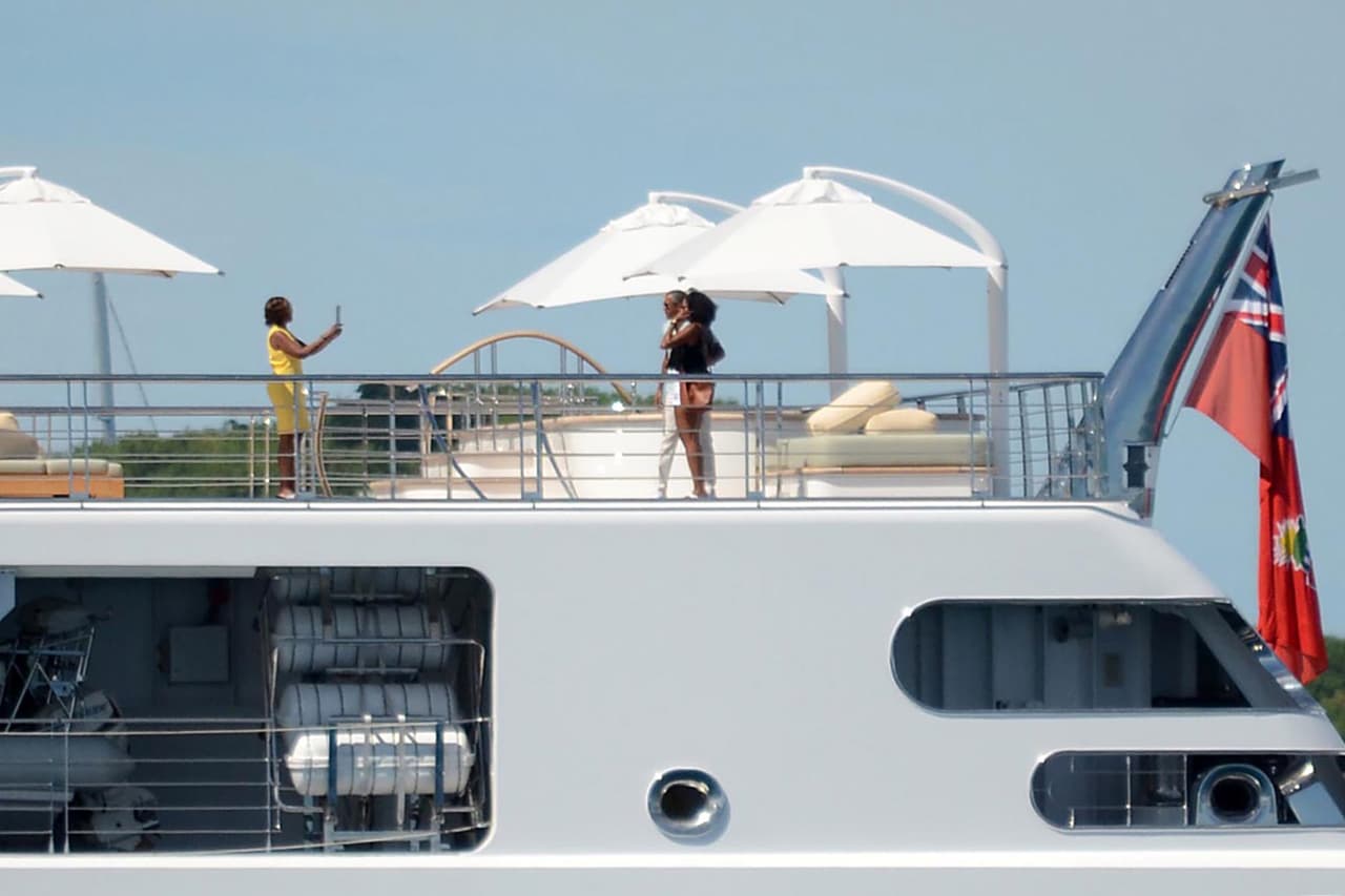Photo © 2017 Zuma Press/The Grosby Group EXCLUSIVE Moorea, April 14, 2017. Former U.S. President Barack Obama takes a holiday photo of his wife, Michelle, as she poses on the top deck of the 138 meter Rising Sun yacht where the couple and celebrity friends spent the morning off the Island of Moorea, in the South Pacific, part of French Polynesia on April 14, 2017. The Obamas were vacationing with Bruce Springsteen, Tom Hanks and Oprah Winfrey and spent two hours aboard music mogul David Geffen's luxury yacht before leaving Tahiti.