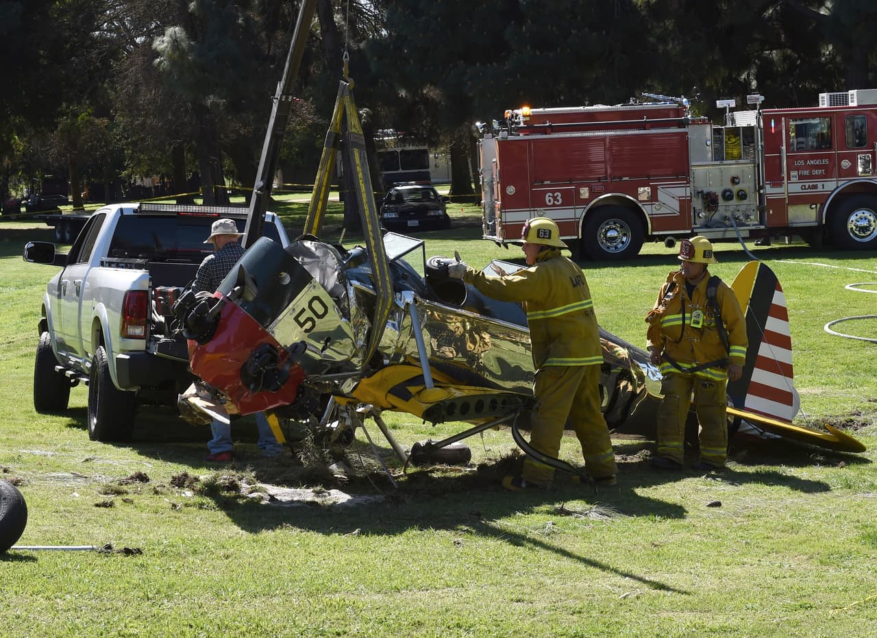 The 1942 Ryan Aeronautical ST3KR plane that crashed onto a golf course and was piloted by US actor Harrison Ford in Venice, California, is removed on March 6, 2015. Ford was injured March 5, 2015 when the small plane he was flying suffered engine failure and crash-landed on a golf course outside Los Angeles, officials said. The 72-year-old "Indiana Jones" and "Star Wars" actor suffered multiple gashes to his head. AFP PHOTO/ MARK RALSTON (Photo credit should read MARK RALSTON/AFP/Getty Images)