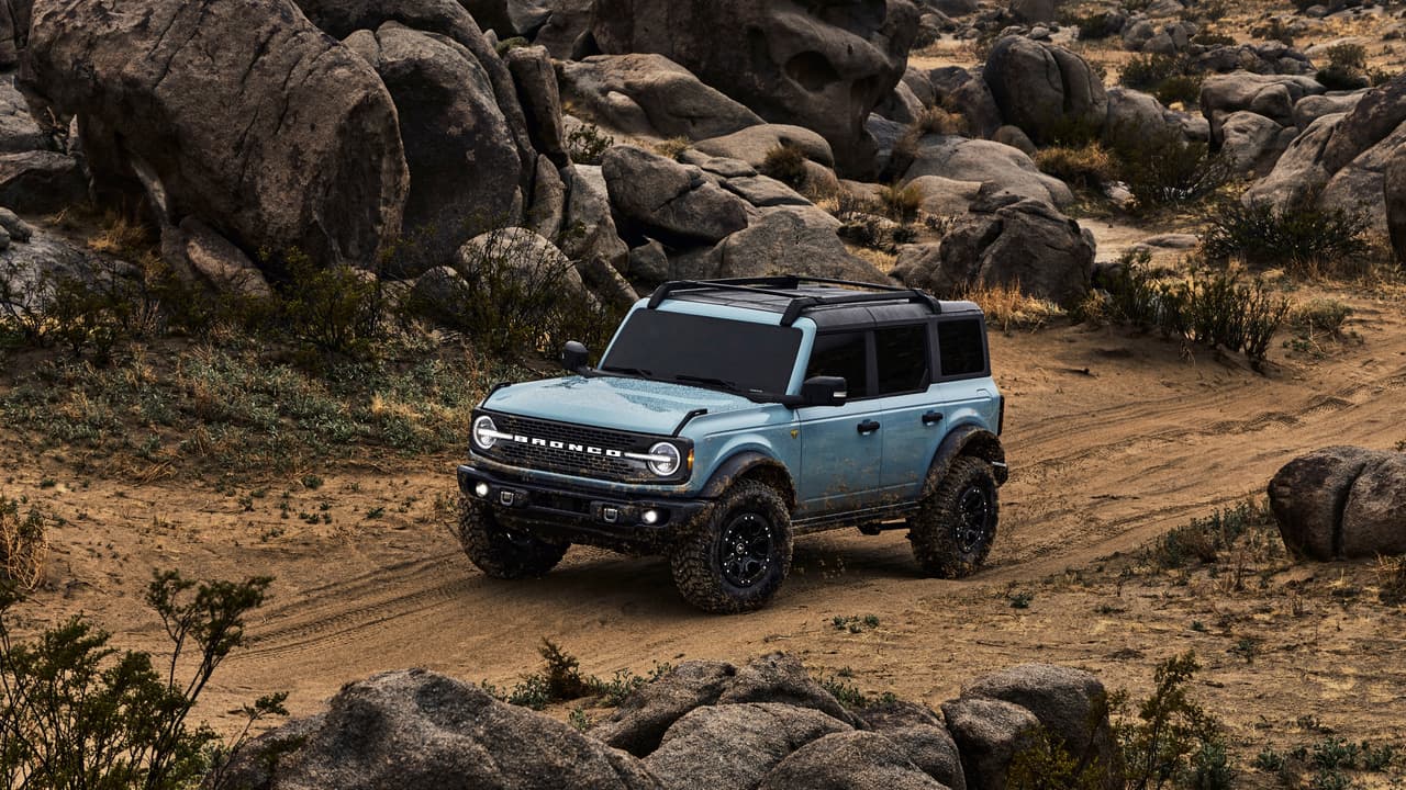 Pre-production 2021 Bronco four-door Badlands series with available Sasquatch™ off-road package in Cactus Gray with the doors, top and rear quarter windows removed.