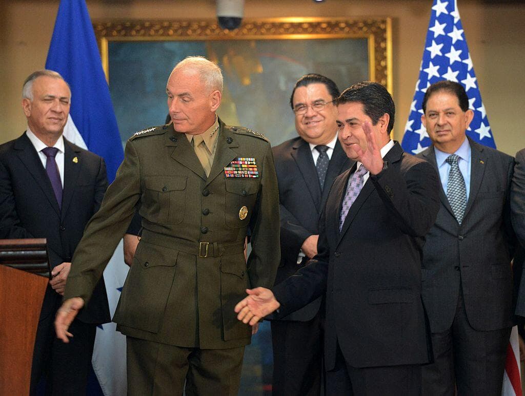 Honduran President Juan Orlando Hernandez and Gen. John Kelly, commander of the U.S. Southern Command prepare to participate in a meeting at the presidential house in Tegucigalpa on June 2, 2014.