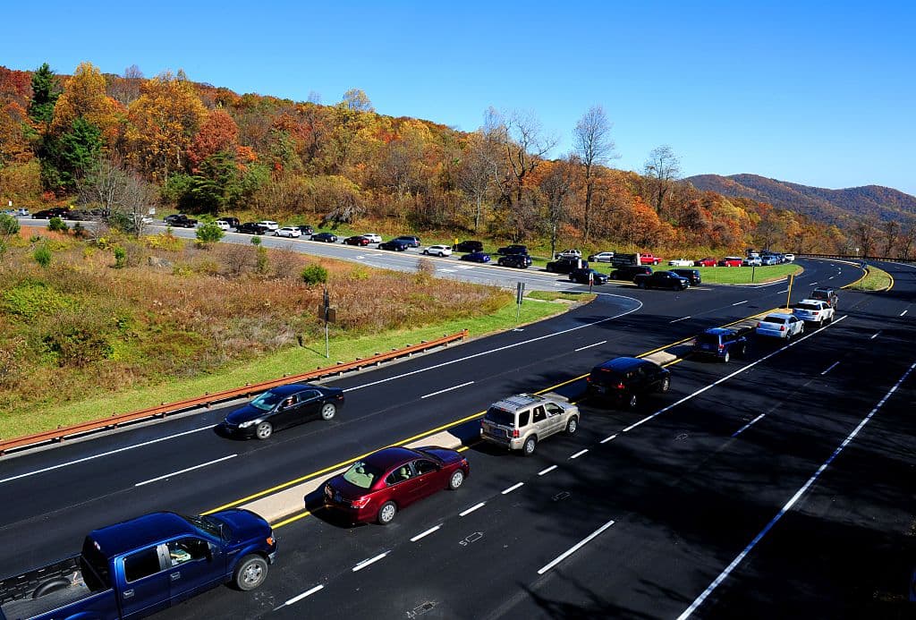 A long line of cars wait to enter Skyline Drive in the Shenandoah National Park in Virginia November 5, 2016. Many hundreds of people came out to enjoy the end of the Fall colors in the park. / AFP / Karen BLEIER (Photo credit should read KAREN BLEIER/AFP/Getty Images)